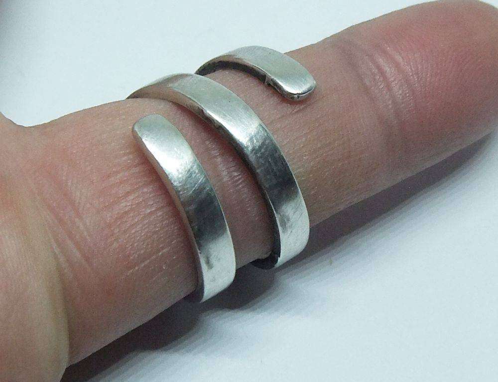 A very unusual sterling silver spiral form ring with designer stamp