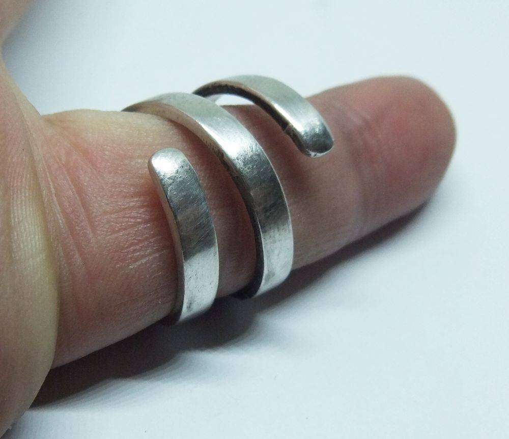 A very unusual sterling silver spiral form ring with designer stamp