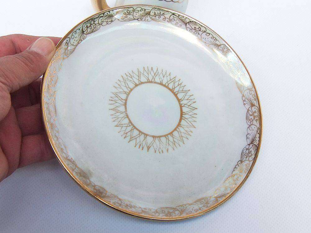 An adorable vintage hand painted porcelain kitty cat themed drink set with rainbow lustre