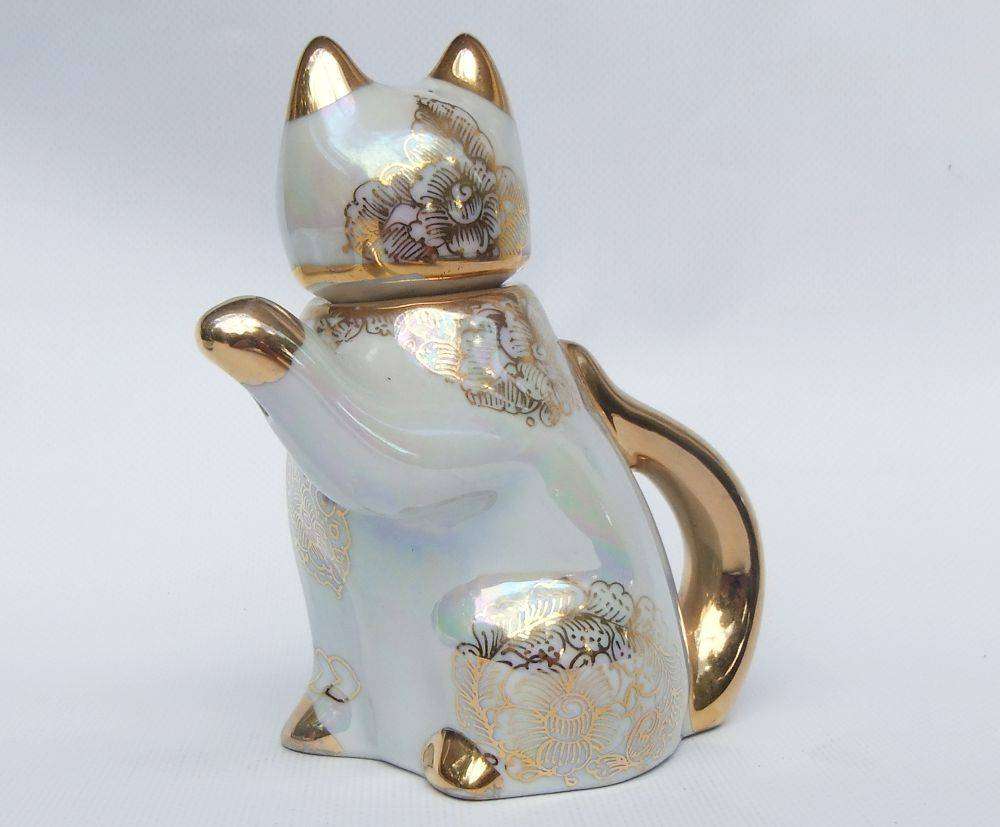 An adorable vintage hand painted porcelain kitty cat themed drink set with rainbow lustre