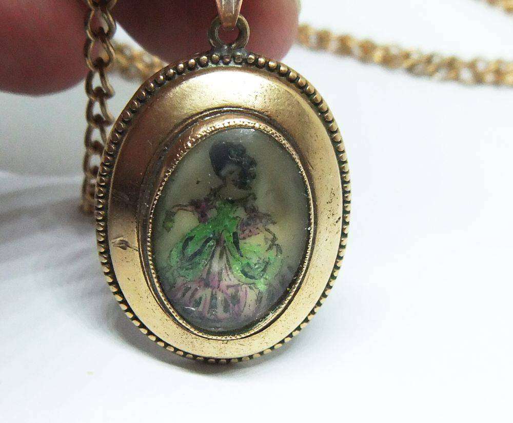 A lovely vintage rolled gold Thomas L Mott pendant with lady theme plus free plated necklace
