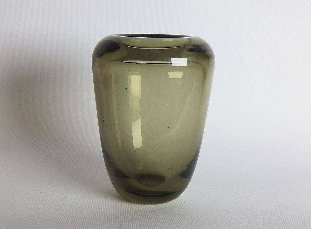 A heavy vintage Holmegaard style glass vase with polished base