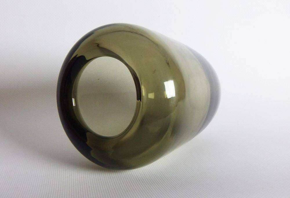 A heavy vintage Holmegaard style glass vase with polished base