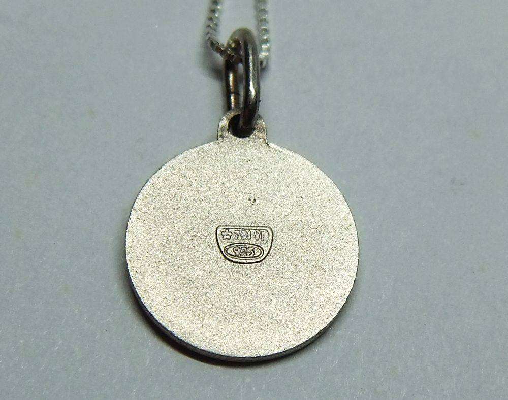 A vintage sterling silver Cancer Zodiac sign pendant plus a sterling silver necklace