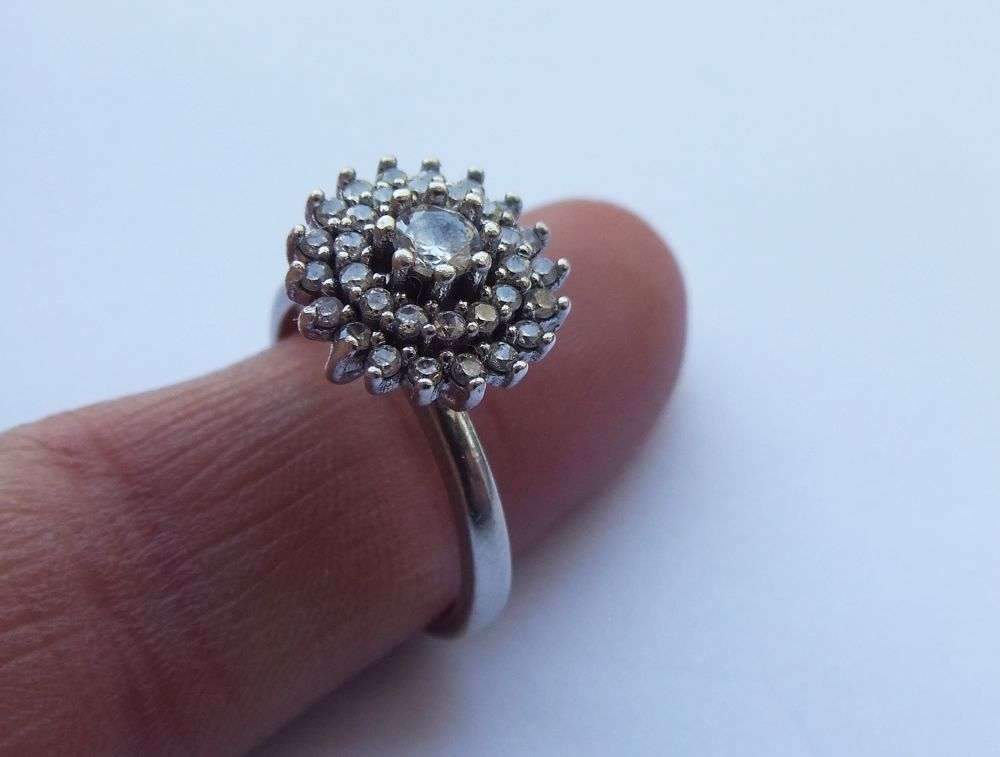 LOOK !! AN AMAZING SOLID STERLING SILVER CLUSTER RING SET WITH LOTS OF FACETED CZ STONES !! WOW !!