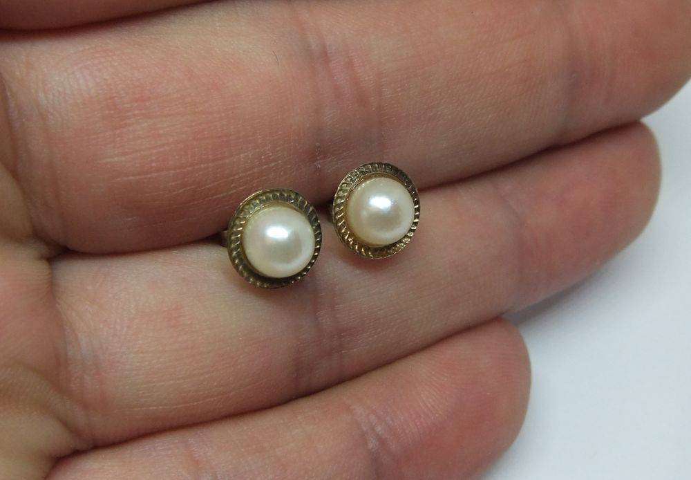 A pair of vintage 9ct gold genuine pearl earrings with timeless appeal