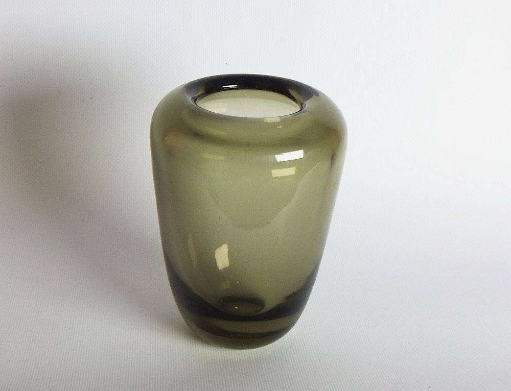 A heavy vintage Holmegaard style glass vase with polished base