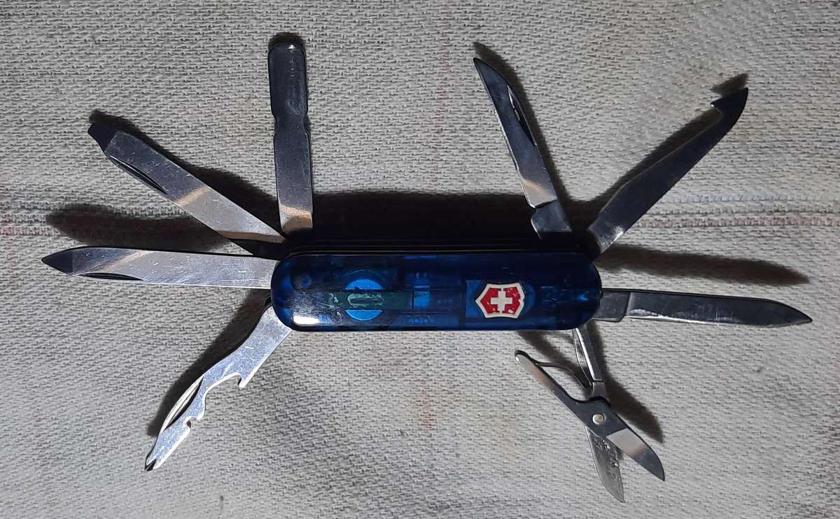 Victorinox Swiss Army Knife - Blue Translucent scales Midnight Mini Champ condition as per pictures