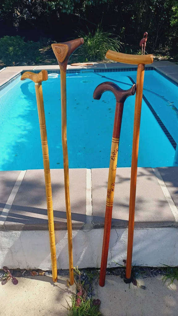 4 Vintage wooden walking sticks.  Price for all