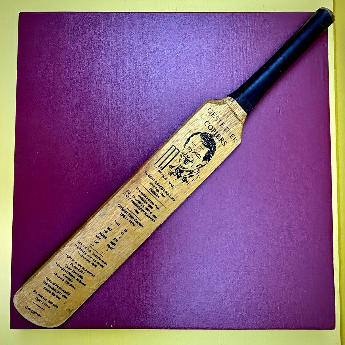 Miniature vintage commemorative cricket bat featuring legendary SA batsman Graeme Pollock