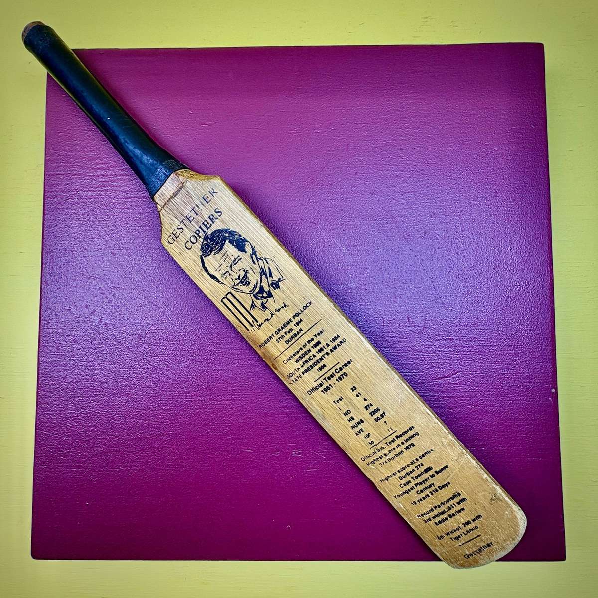 Miniature vintage commemorative cricket bat featuring legendary SA batsman Graeme Pollock