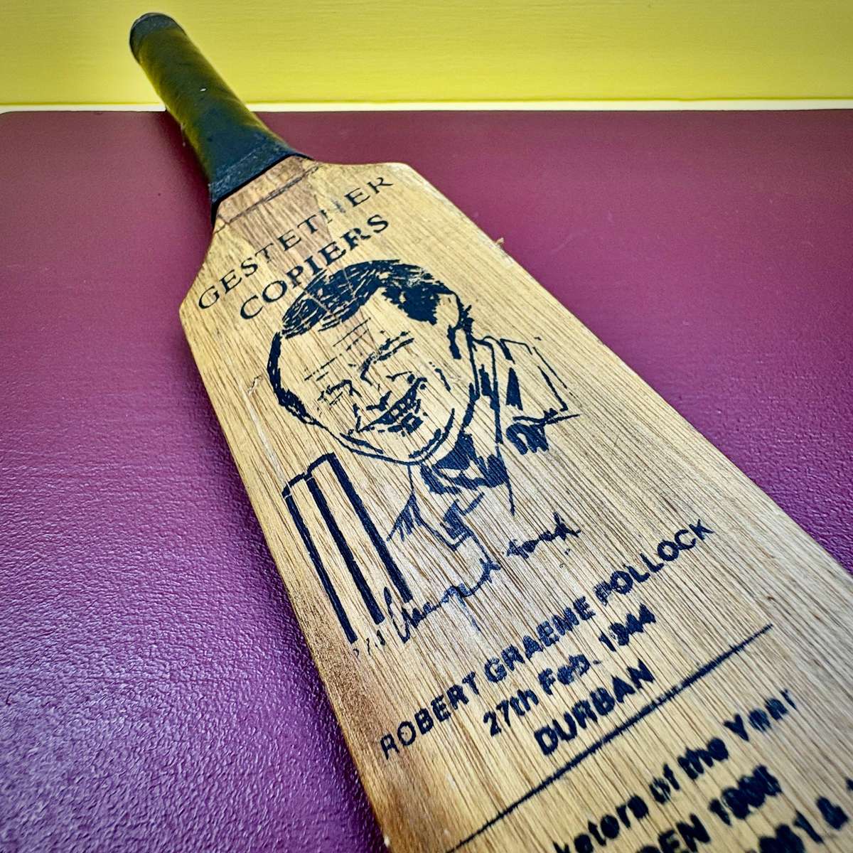 Miniature vintage commemorative cricket bat featuring legendary SA batsman Graeme Pollock