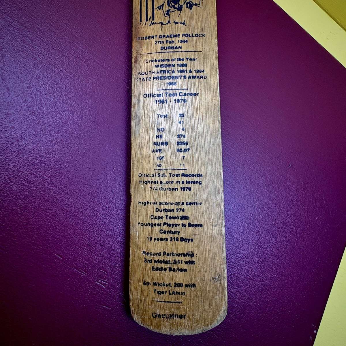 Miniature vintage commemorative cricket bat featuring legendary SA batsman Graeme Pollock