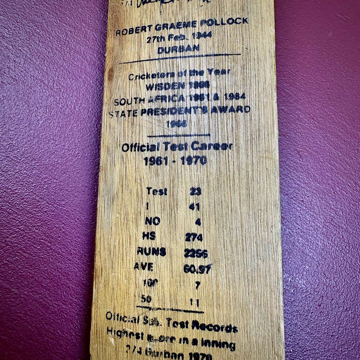 Miniature vintage commemorative cricket bat featuring legendary SA batsman Graeme Pollock