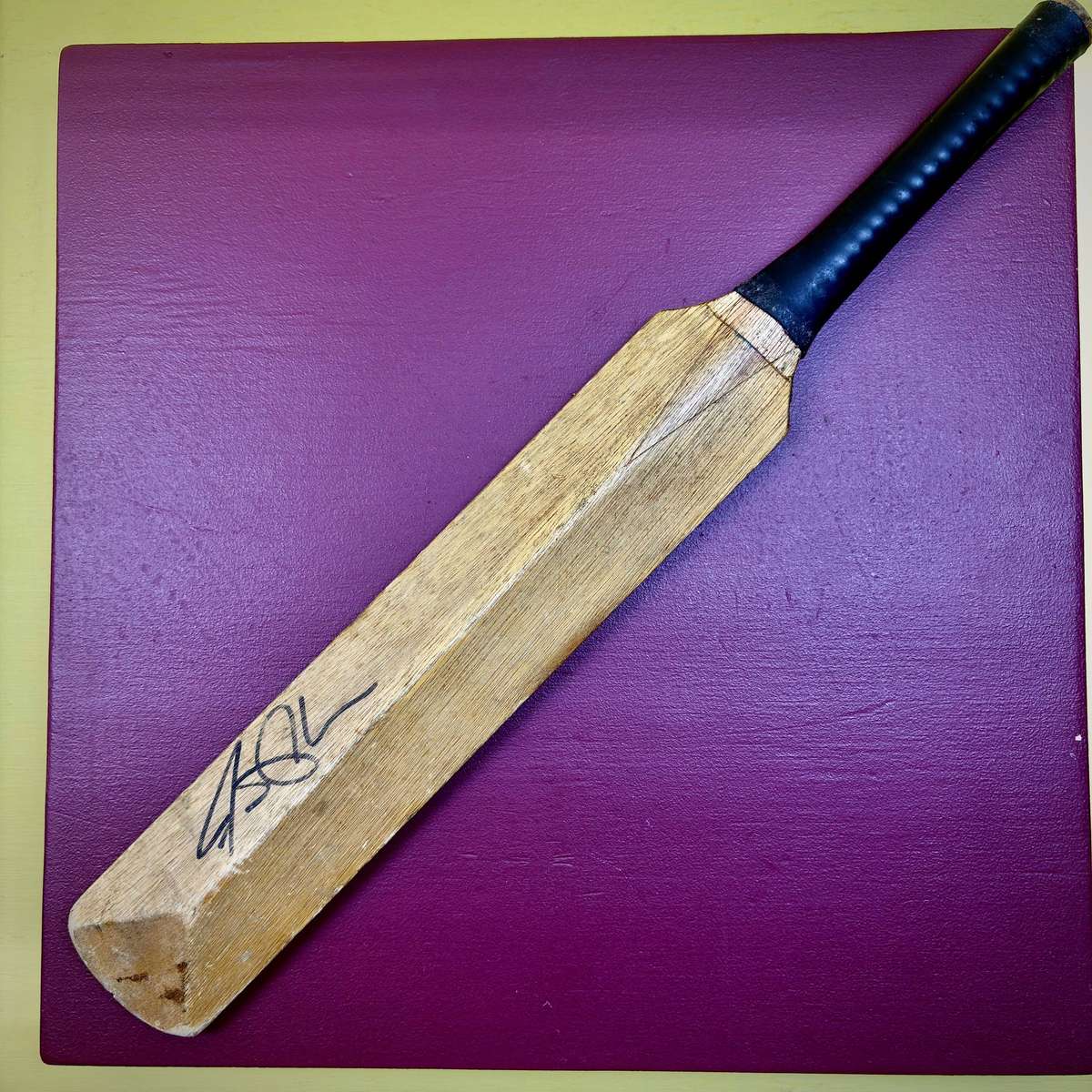 Miniature vintage commemorative cricket bat featuring legendary SA batsman Graeme Pollock