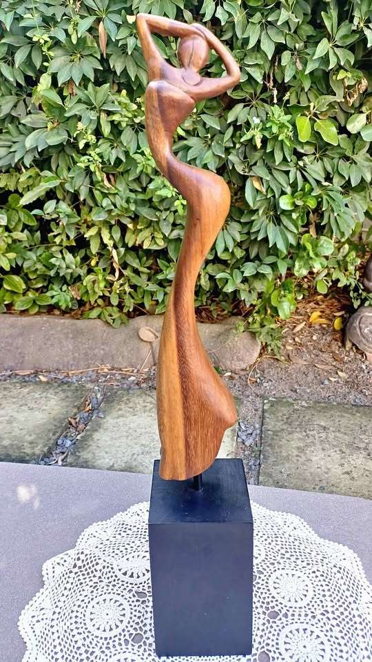Elegant wooden abstract female figure on pedestal