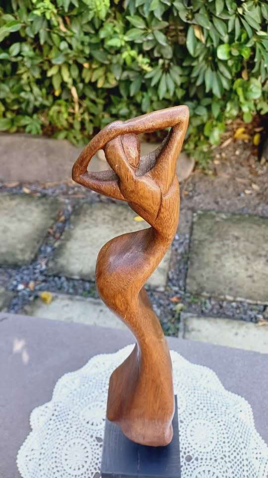 Elegant wooden abstract female figure on pedestal