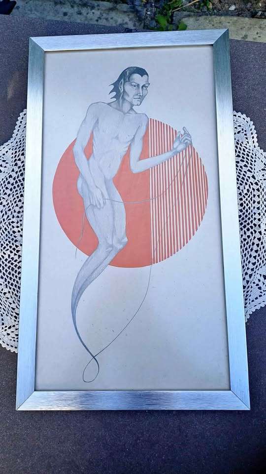 Bizarre male figure print. Framed behind glass.