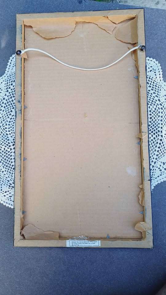 Bizarre male figure print. Framed behind glass.