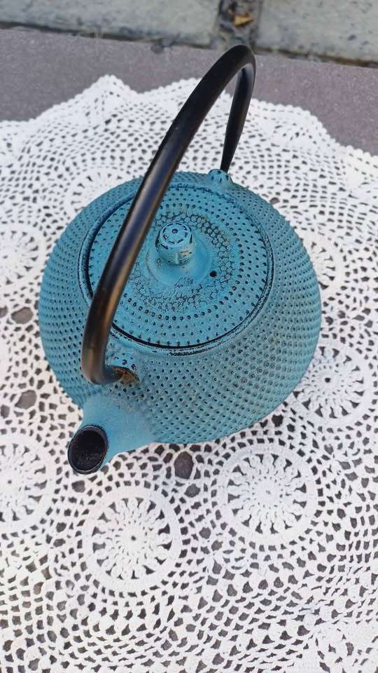 Teal Oriental cast iron teapot with stainless steel infuser