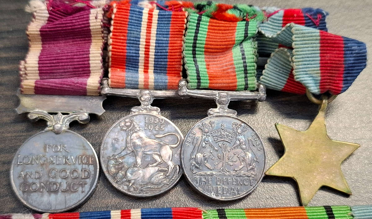 group of British World War II medals and miniature set