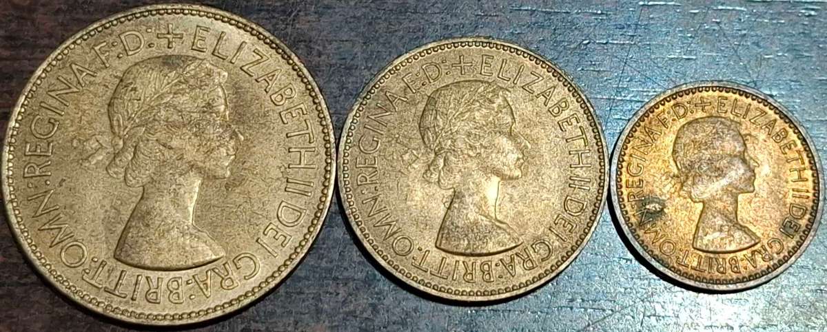 1953 three British pre-decimal coins: a One Penny, a Half Penny, and a Farthing