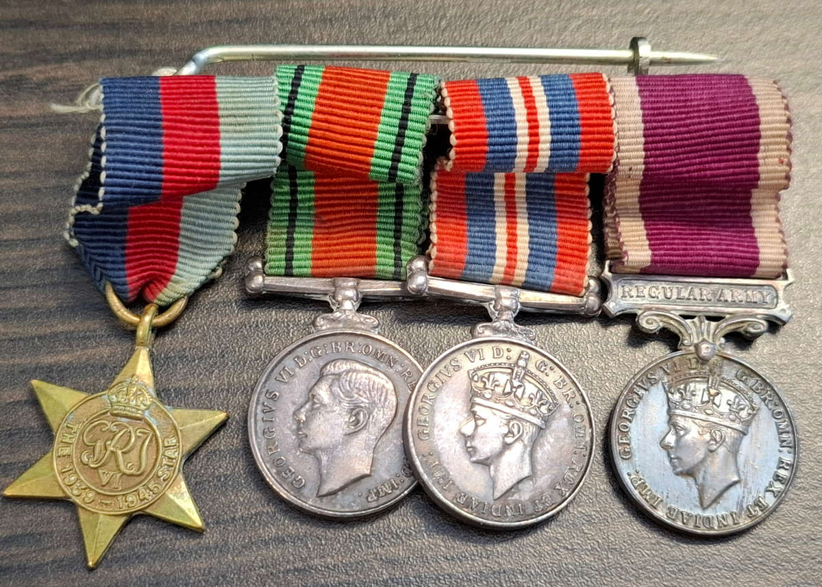group of British World War II medals and miniature set