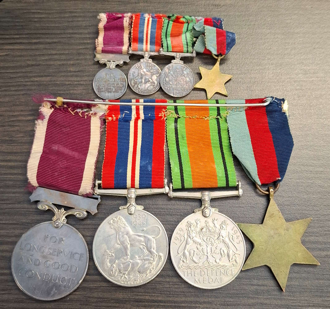 group of British World War II medals and miniature set