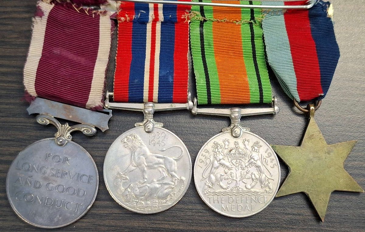 group of British World War II medals and miniature set