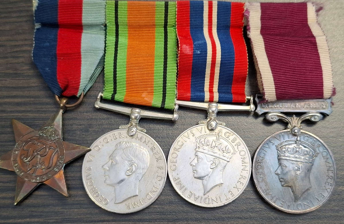group of British World War II medals and miniature set