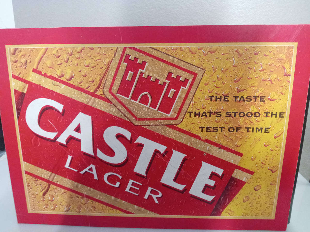 Bar Accessories : Castle Lager Plastic Sign and Empty Pint Crate.