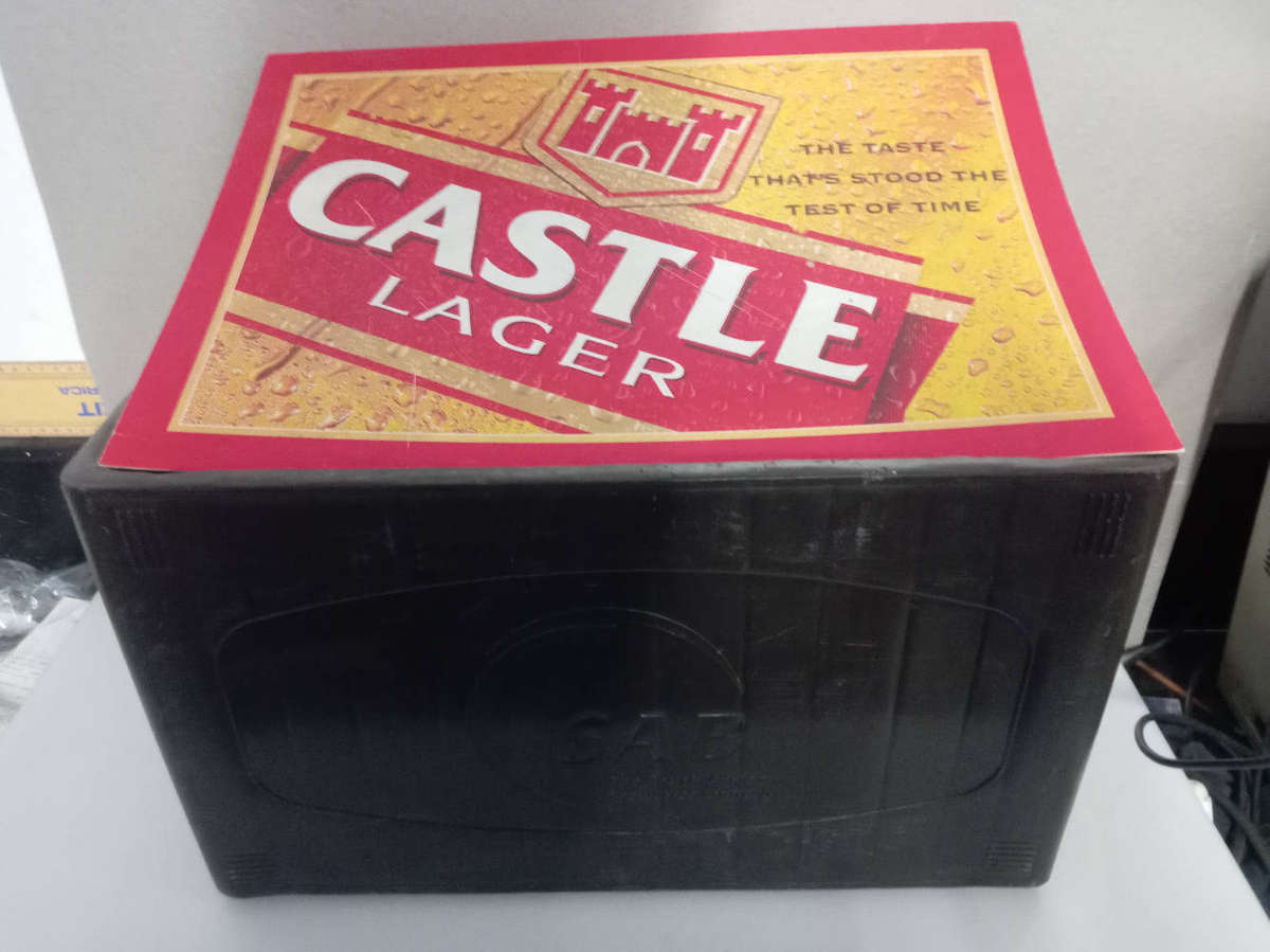 Bar Accessories : Castle Lager Plastic Sign and Empty Pint Crate.