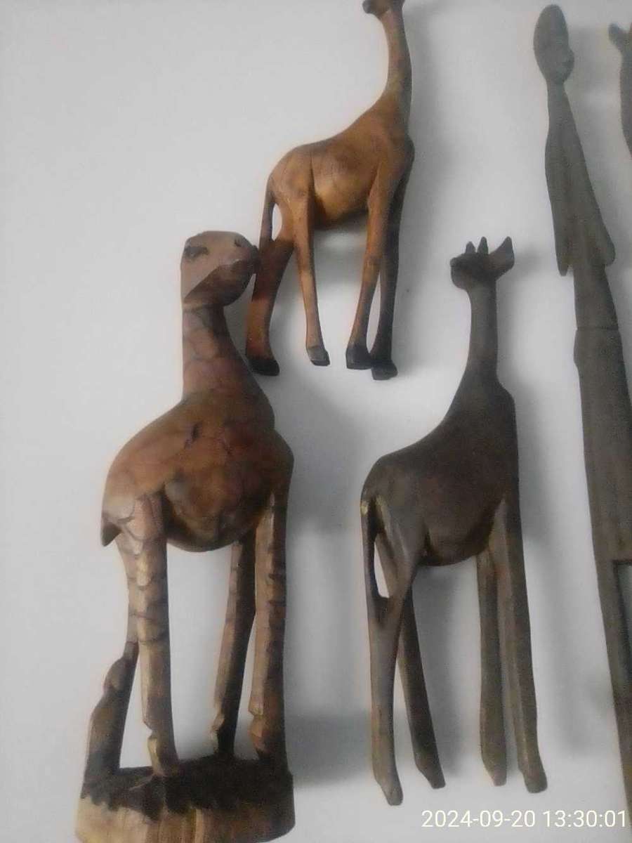 AFRICAN HAND CARVED WOODEN GIRAFFES AND FIGURINE.