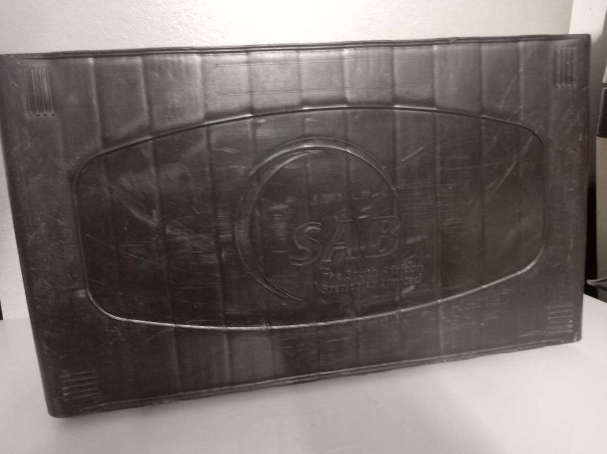 Bar Accessories : Castle Lager Plastic Sign and Empty Pint Crate.