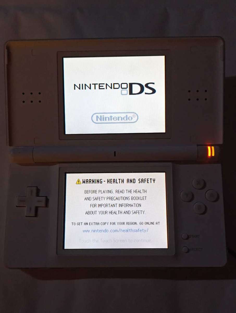 Nintendo DS Lite Console w/ original charger + 2 games