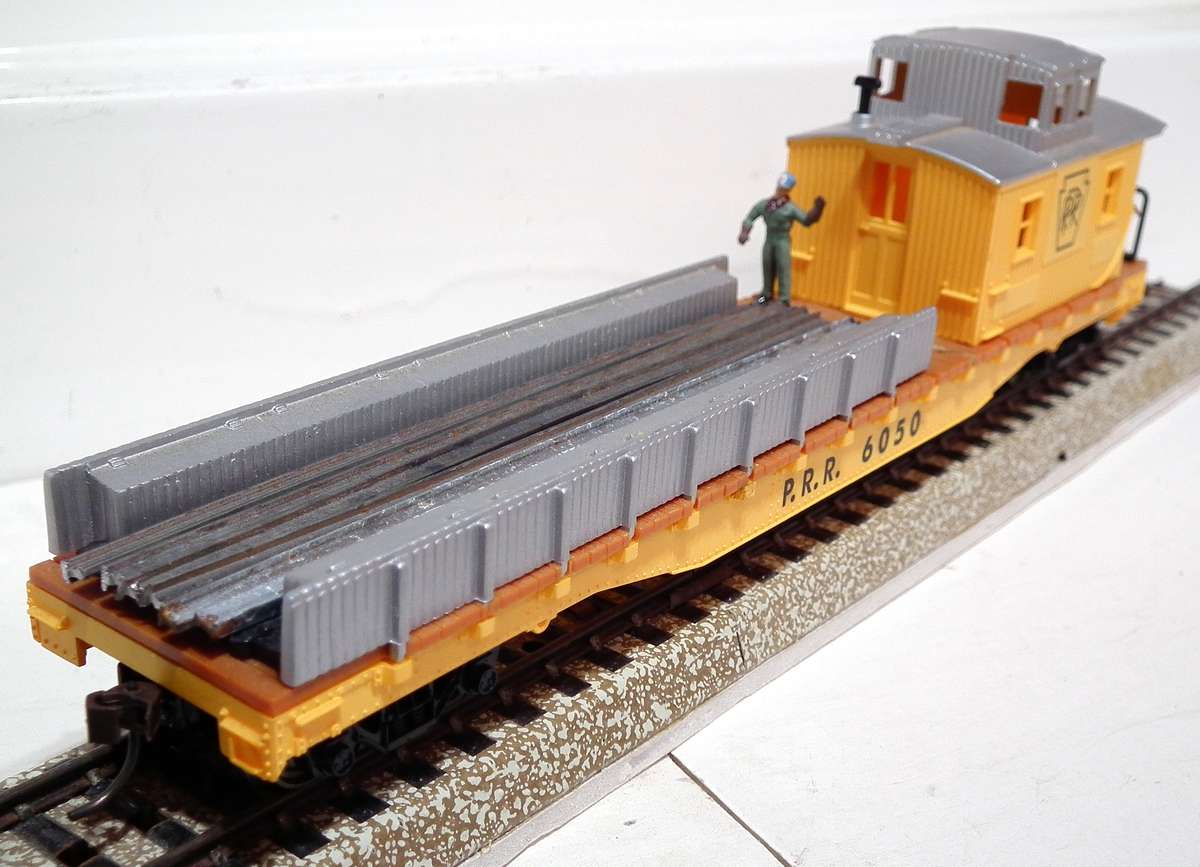 MEHANO HO:  P.R.R. Track Maintenance Car with Track Load in Good Un-Boxed condition.