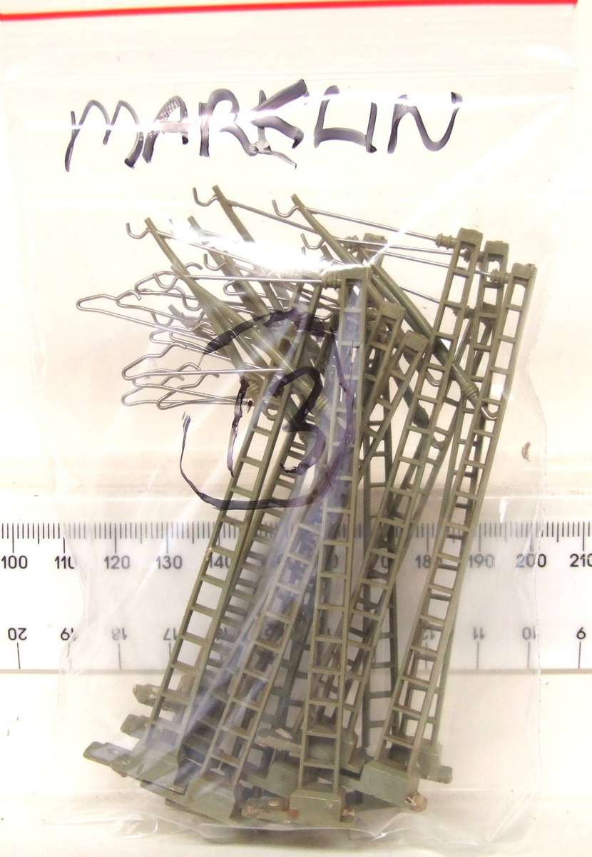 MARKLIN HO:  On Auction are these 13pc Overhead Centenary Masts in Good Used Condition.(GR)