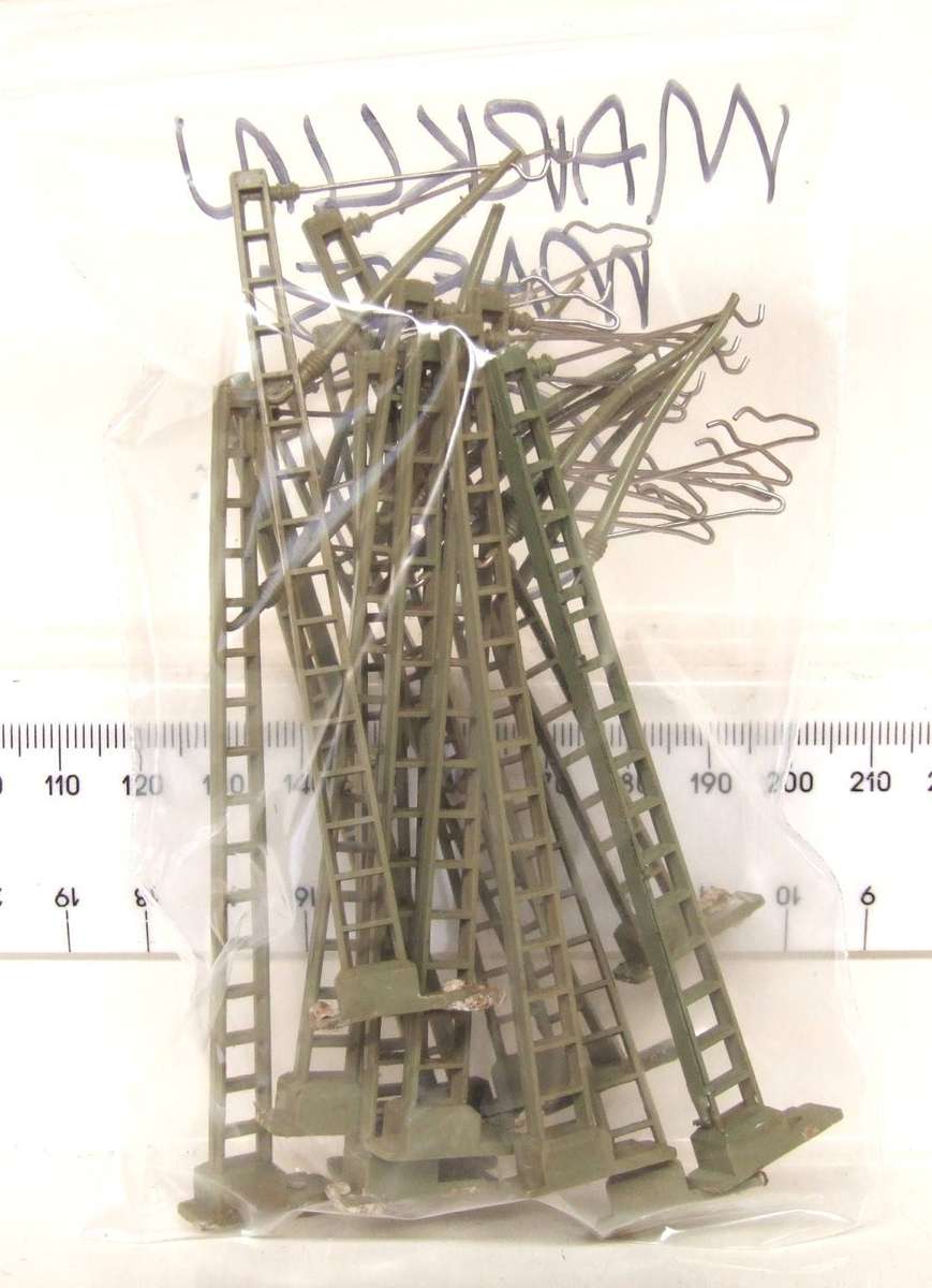 MARKLIN HO:  On Auction are these 13pc Overhead Centenary Masts in Good Used Condition.(GR)