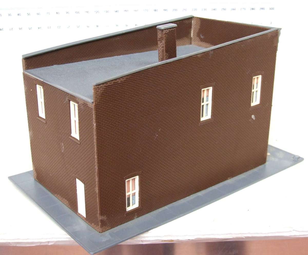 SCENERY HO:  On Auction is this European Plastic Multi Story Building in Fair Used Condition.