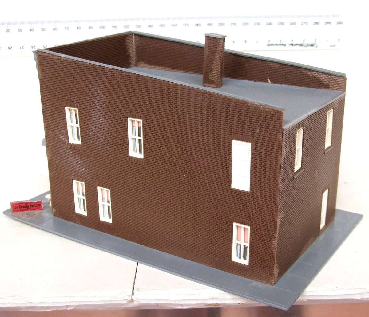 SCENERY HO:  On Auction is this European Plastic Multi Story Building in Fair Used Condition.