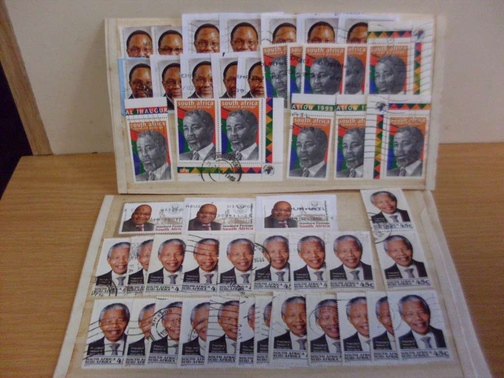 A JOBLOT OF LATE MANDELA AND OTHER PREVIOUS SA PRESIDENTS USED  POSTAGE STAMPS
