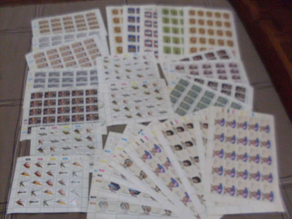 26 FULL STAMP  SHEETS ...MINT/POSTAL STAMPED