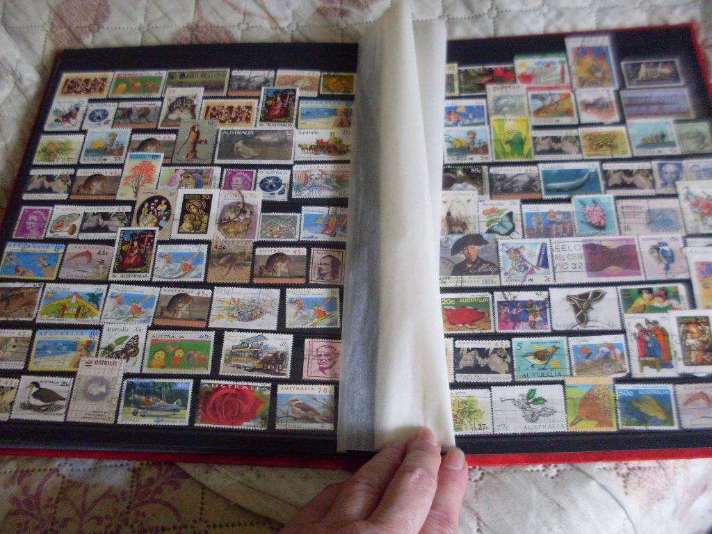 STAMP ALBUM WITH MOSTLY GERMANY AND AUSTRALIA USED/UNUSED POSTAGE STAMPS