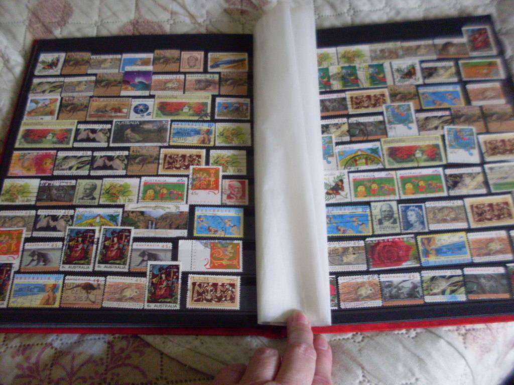 STAMP ALBUM WITH MOSTLY GERMANY AND AUSTRALIA USED/UNUSED POSTAGE STAMPS
