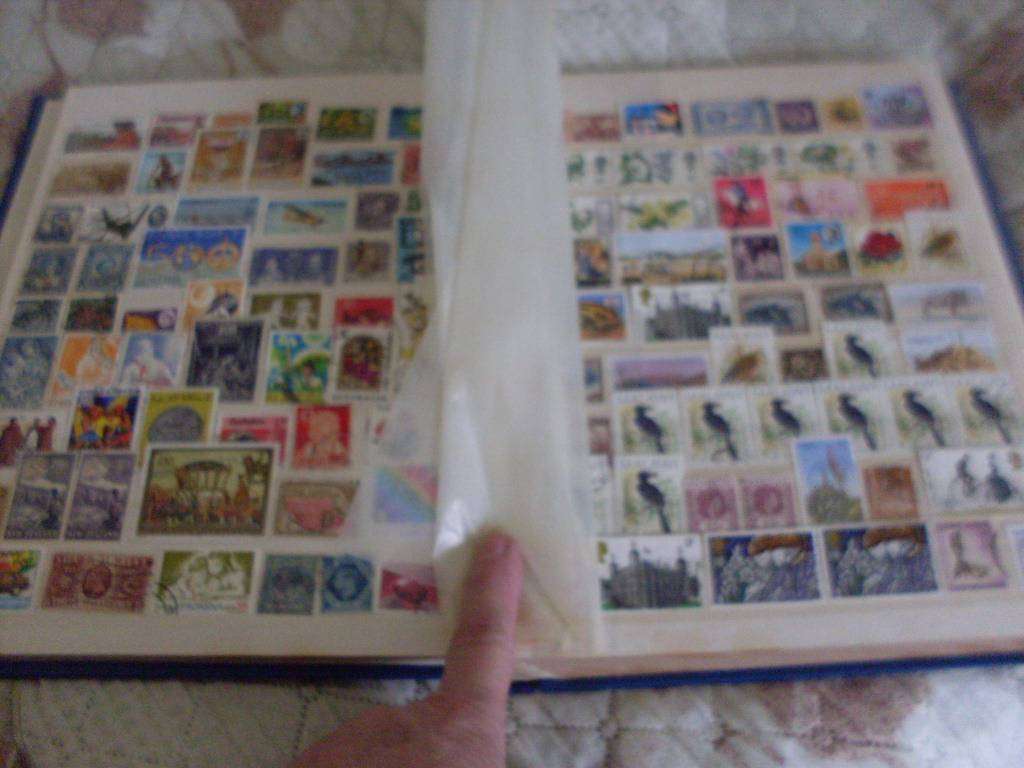 30 PAGE STAMP ALBUM...COMMONWEALTH /WORLD/ GREAT BRITAIN MIXED POSTAGE STAMPS