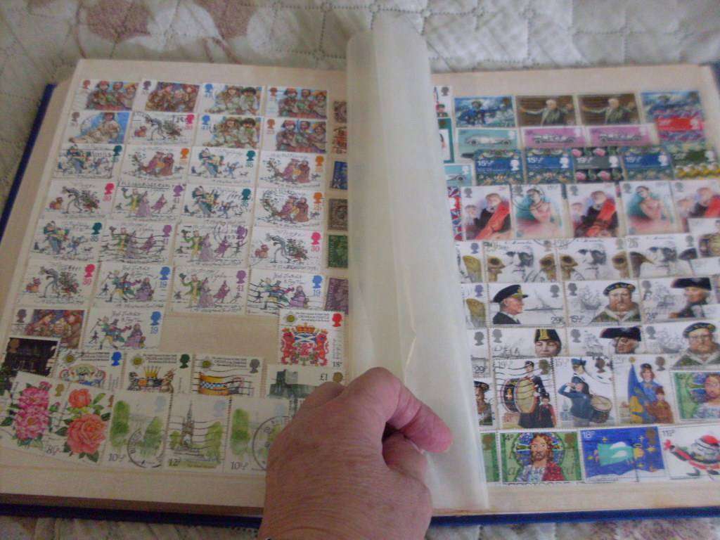 30 PAGE STAMP ALBUM...COMMONWEALTH /WORLD/ GREAT BRITAIN MIXED POSTAGE STAMPS