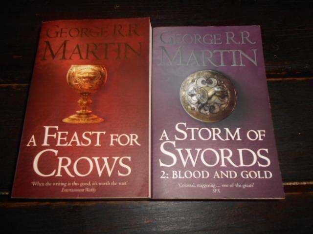 Two George Martin books - A strom of Swords & a Feast of Crows paperbacks