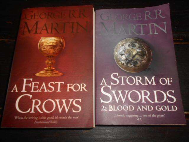 Two George Martin books - A strom of Swords & a Feast of Crows paperbacks