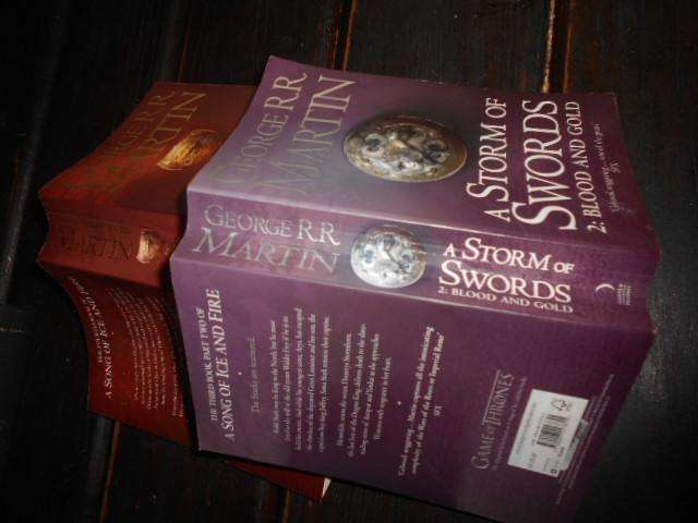 Two George Martin books - A strom of Swords & a Feast of Crows paperbacks