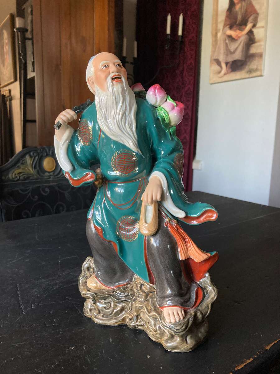 LARGE ORIENTAL STATUE